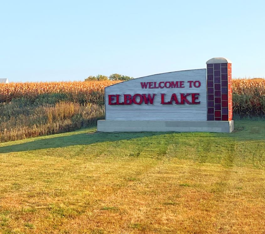 Town sign that reads Welcome to Elbow Lake.