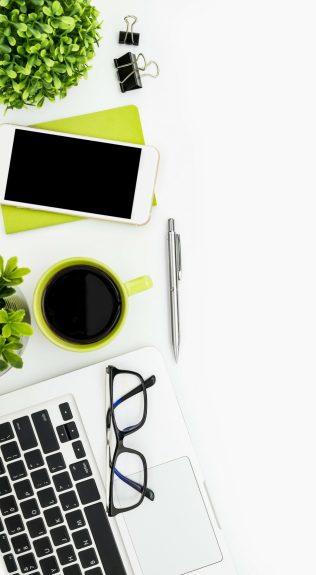 White,Office,Desk,Table,With,Laptop,,Coffee,,Supplies,And,Plants. Organized Apex Engineering Group Desk